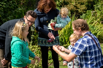 Adults and Childrens exploring the grounds